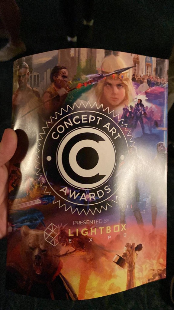 Concept Art Awards book cover in hand